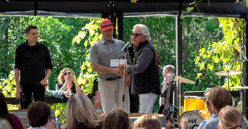 Owner Carl Sparkes presents a cheque for 10,000 to Mr. Mike McPhee, fundraising Chair for the Cape Breton Regional Health Foundation's “Cancer Care Here at Home” project.